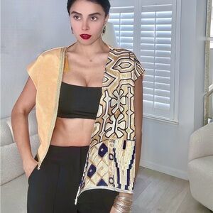 Handcrafted vest with persian fabric.